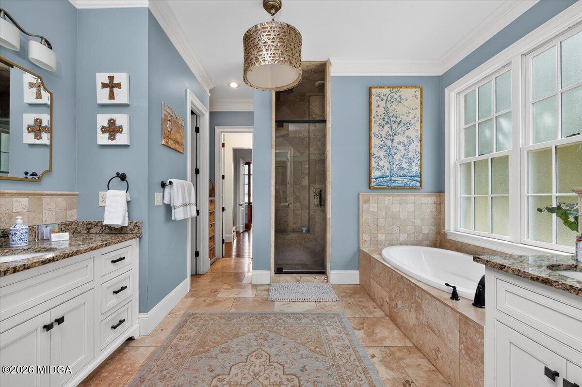 106 Lagrange Place Macon, GA 31210 - Photo 24 of 76 a bathroom with a granite countertop sink a toilet a mirror and shower