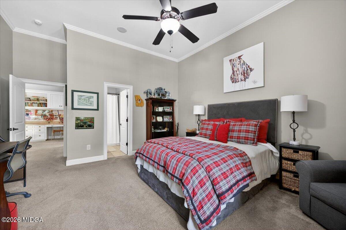 106 Lagrange Place Macon, GA 31210 - Photo 44 of 76 a bedroom with a large bed and a chandelier