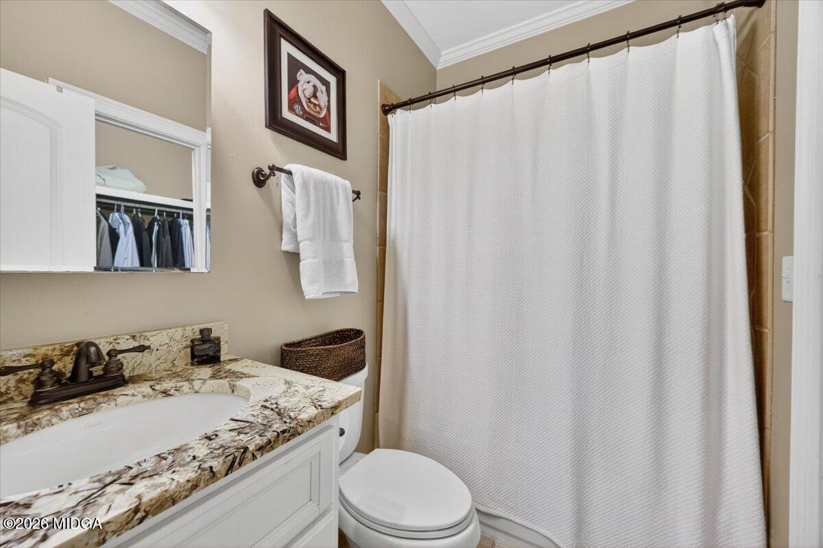106 Lagrange Place Macon, GA 31210 - Photo 45 of 76 a bathroom with a granite countertop sink and a toilet