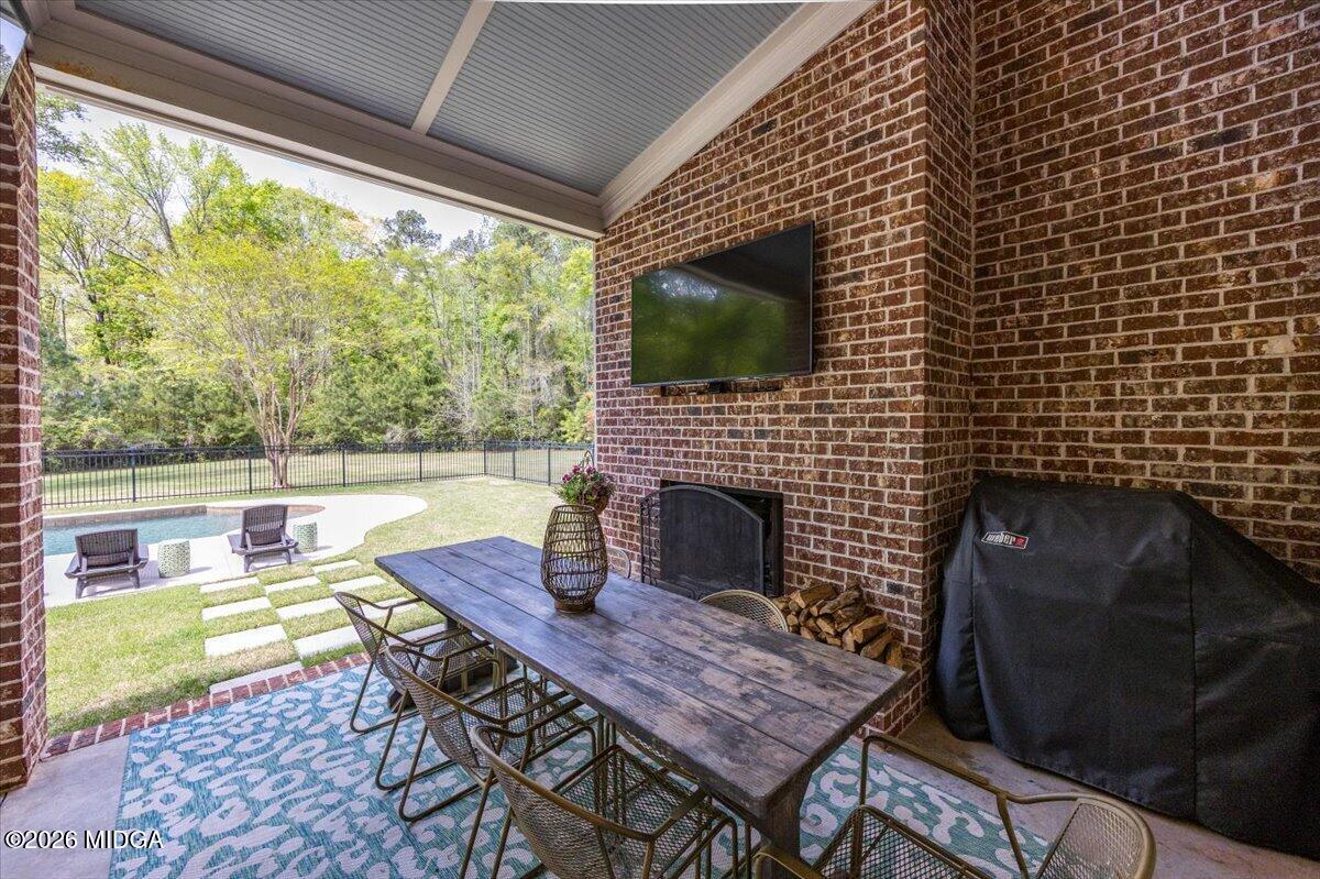 106 Lagrange Place Macon, GA 31210 - Photo 52 of 76 a outdoor dining space with furniture and a fireplace