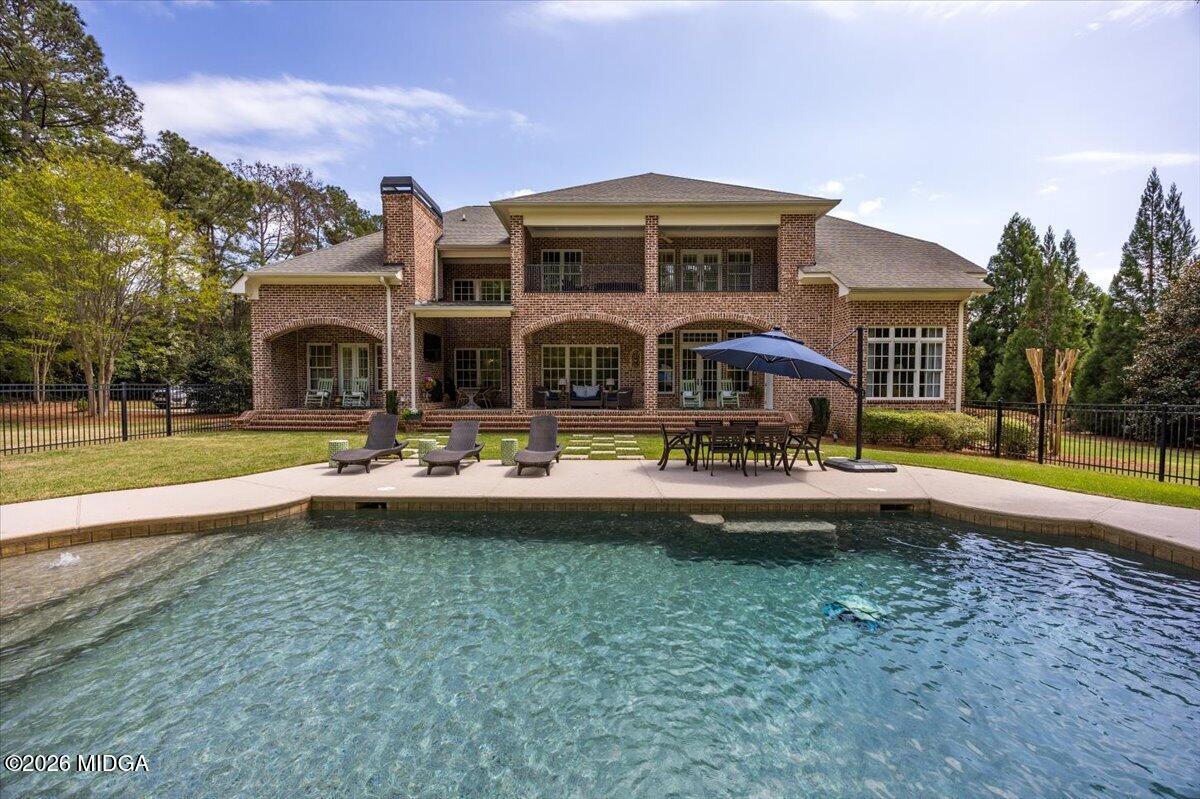 106 Lagrange Place Macon, GA 31210 - Photo 56 of 76 a front view of a house with swimming pool and a yard