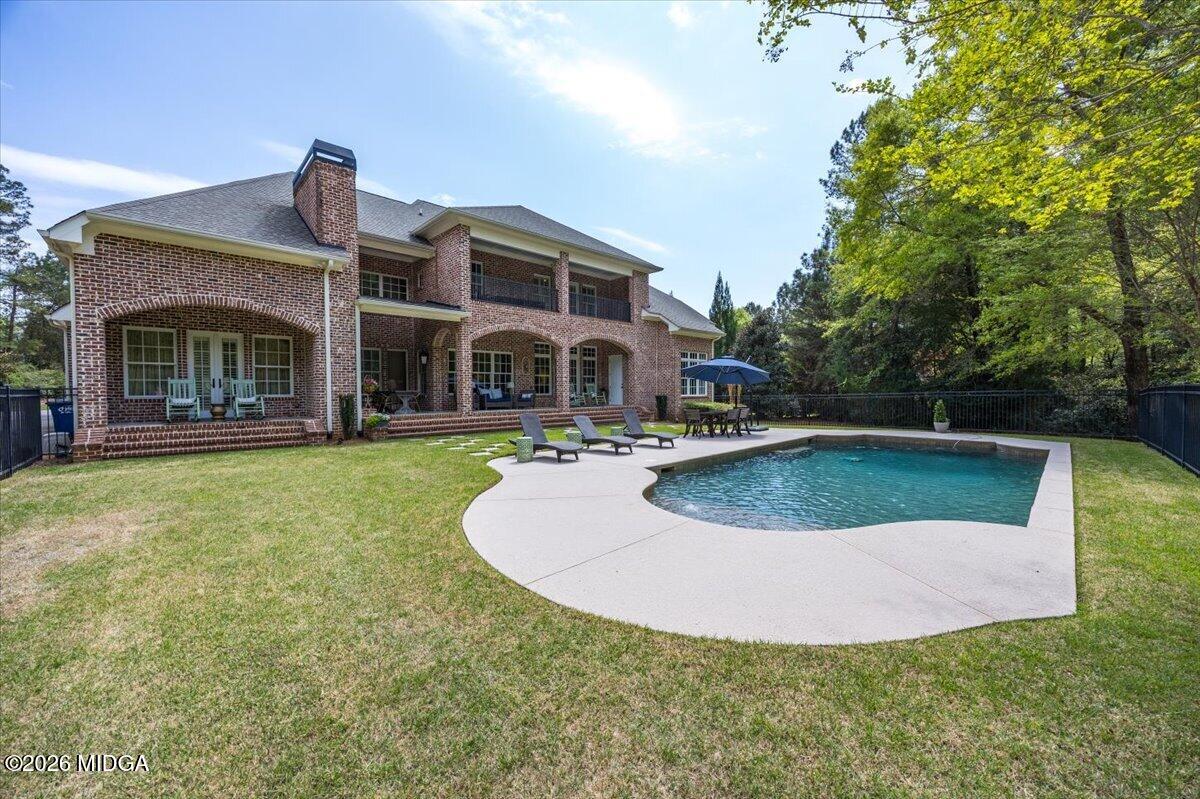 106 Lagrange Place Macon, GA 31210 - Photo 58 of 76 a view of a house with swimming pool and yard