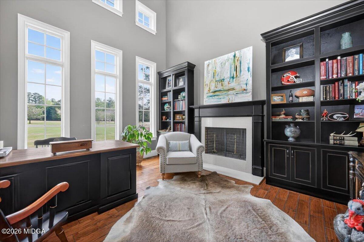 106 Lagrange Place Macon, GA 31210 - Photo 7 of 76 a living room with furniture a bookshelf and a fireplace