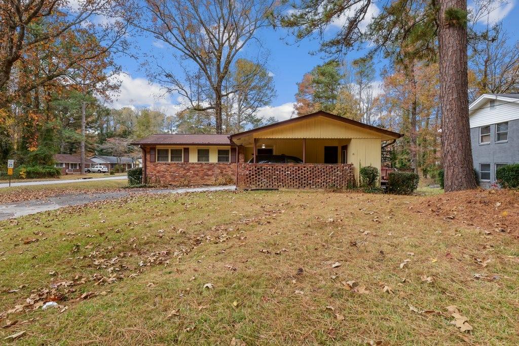 2329 Colorado Trail Southwest Atlanta, GA 30331 - Photo 1 of 1 a front view of a house with a yard