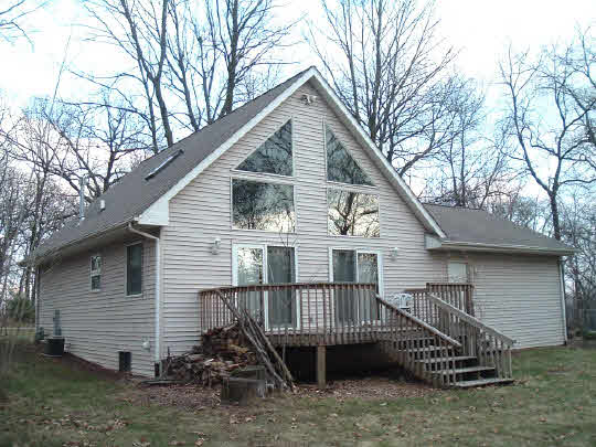 705 Westmore Road Davis, IL 61019 - Photo 1 of 4 a view of a house with a roof deck