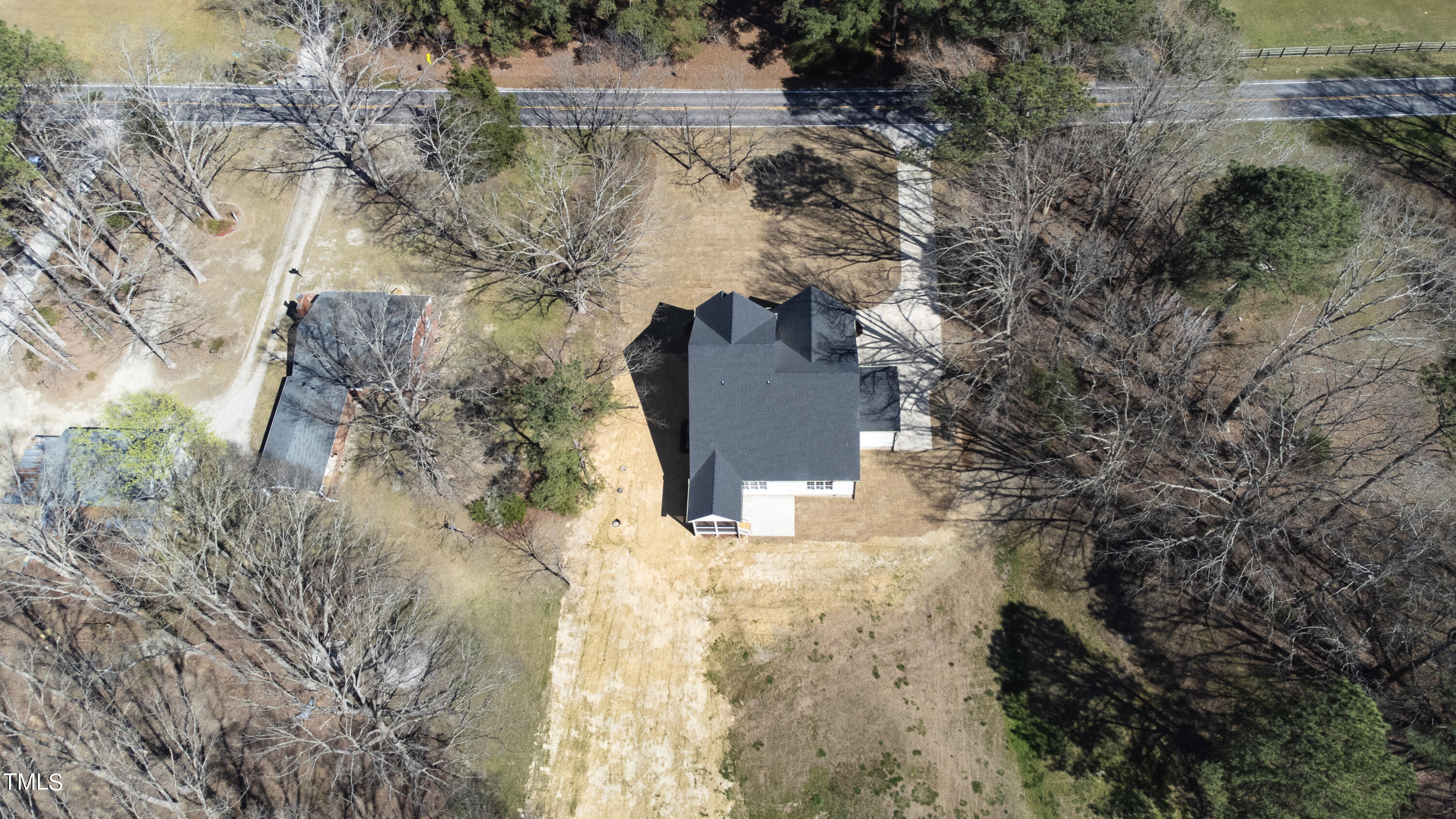 2337 Pearces Road Zebulon, NC 27597 - Photo 12 of 41 a view of a yard with trees