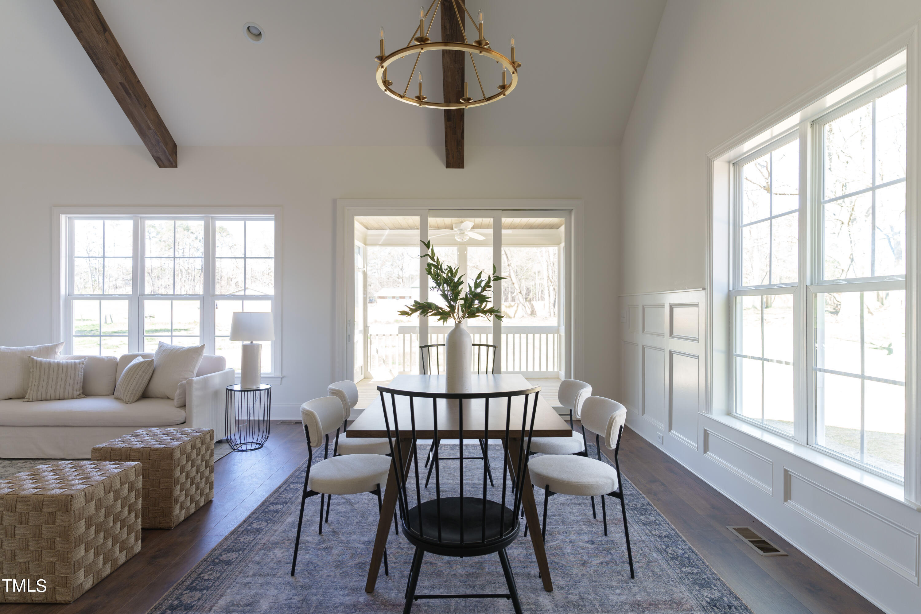 2337 Pearces Road Zebulon, NC 27597 - Photo 19 of 41 a dining room with furniture a chandelier and wooden floor