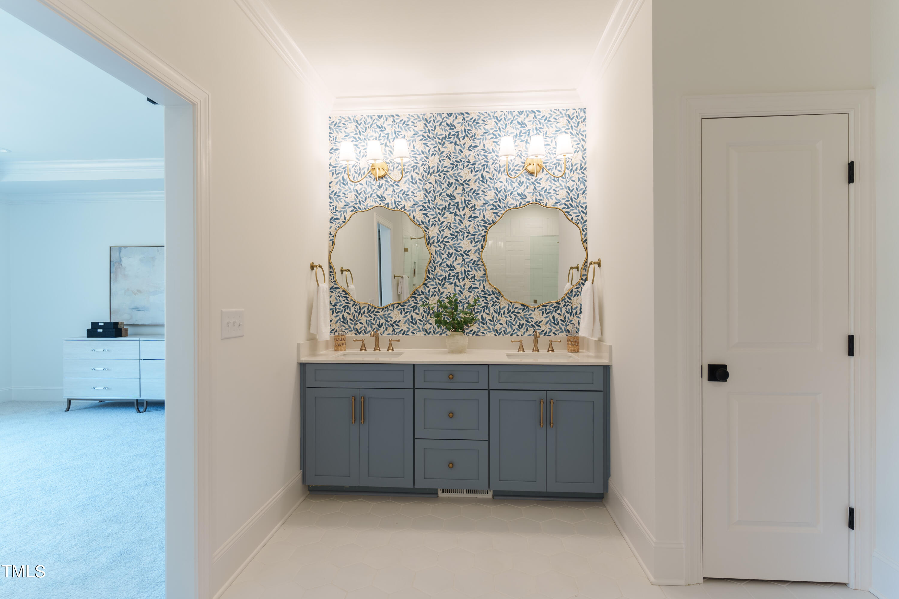 2337 Pearces Road Zebulon, NC 27597 - Photo 27 of 41 a bathroom with a sink a mirror and a vanity