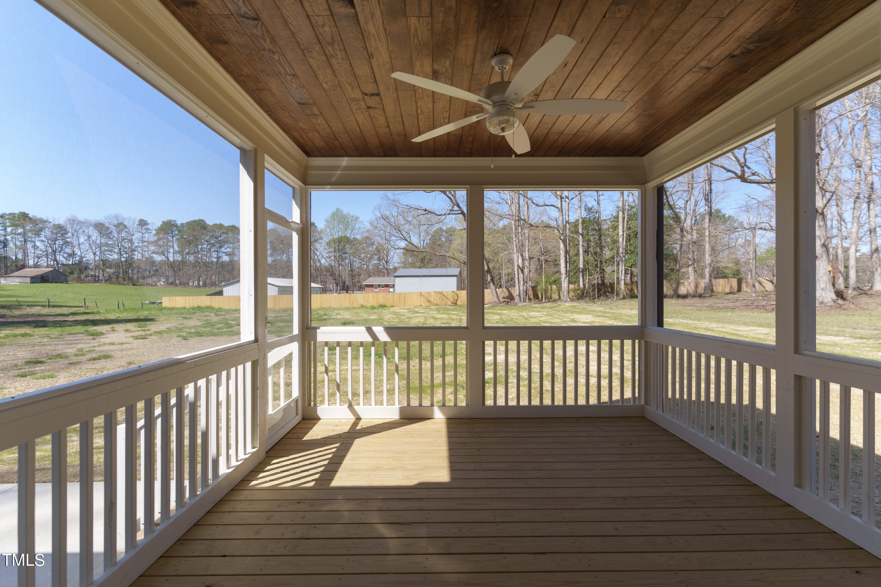 2337 Pearces Road Zebulon, NC 27597 - Photo 8 of 41 a view of a porch with wooden floor of the house