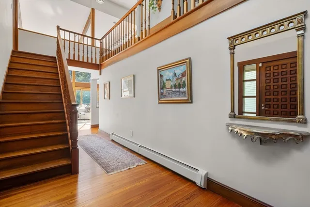 a view of an entryway with wooden floor