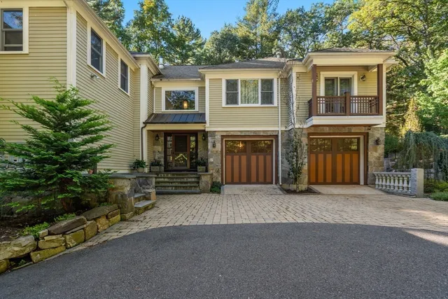 a view of a house with a yard and sitting area