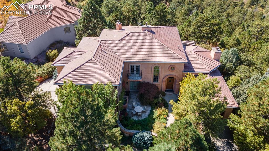 a aerial view of a house with a yard and garden