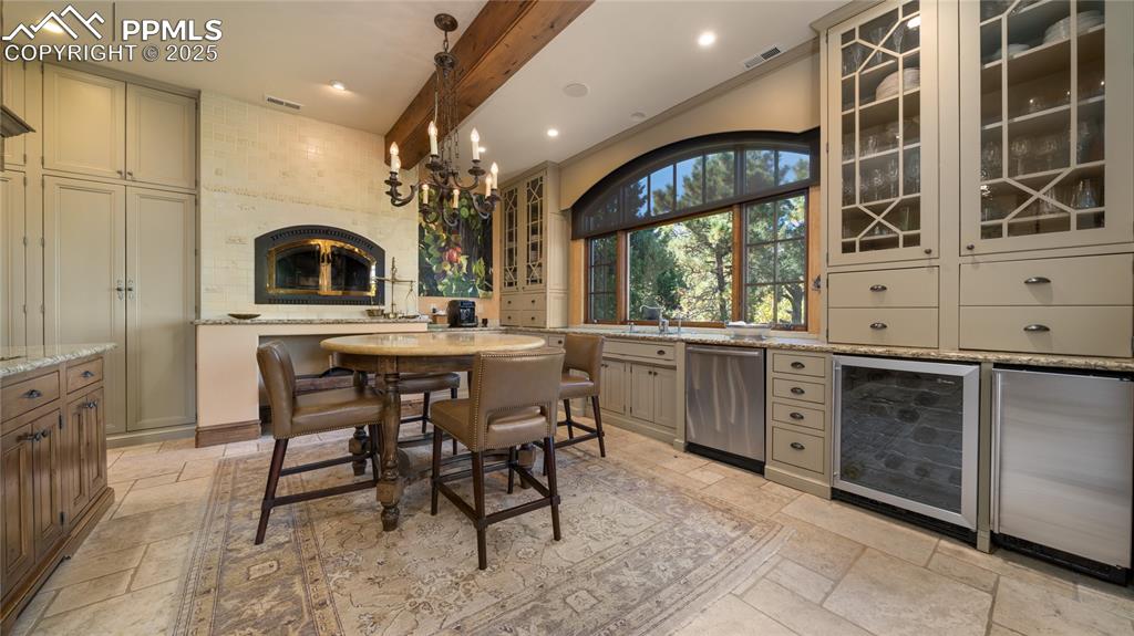4896 Stonehill Road Colorado Springs, CO 80918 - Photo 11 of 42 a kitchen with a sink cabinets and window
