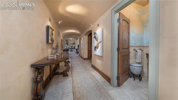 a view of a hallway with entryway and hall