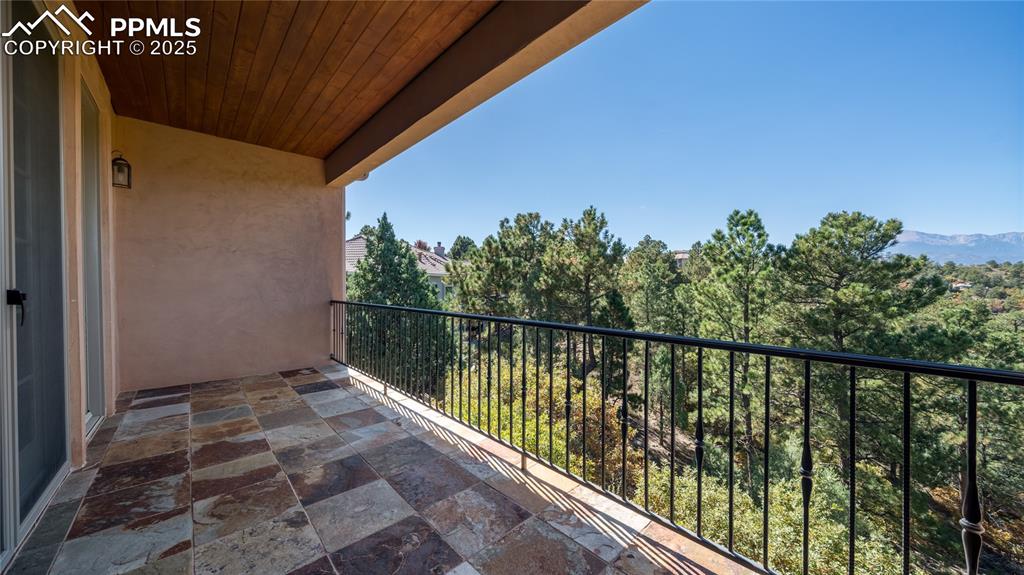 4896 Stonehill Road Colorado Springs, CO 80918 - Photo 22 of 42 a balcony with trees in front of it