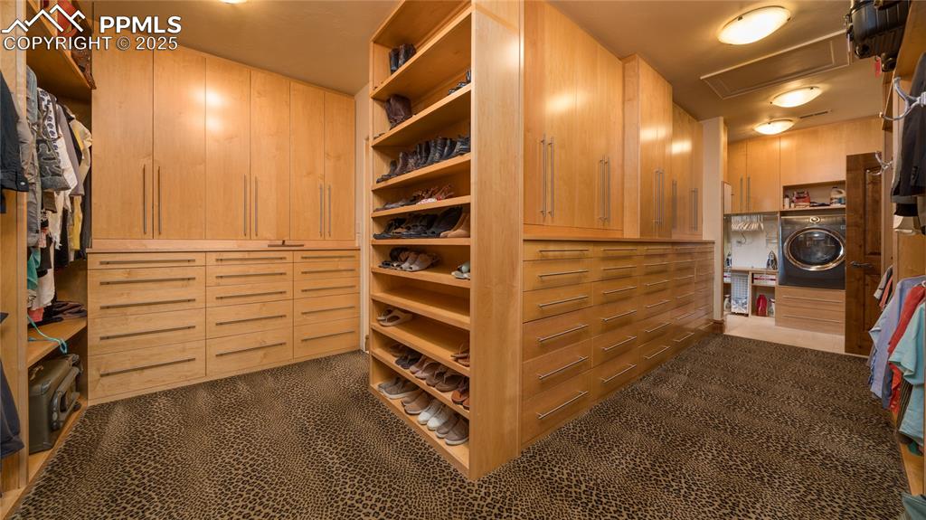 4896 Stonehill Road Colorado Springs, CO 80918 - Photo 26 of 42 a view of walk in closet with clothes and shoes