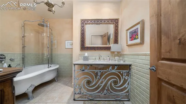 a bathroom with a sink a mirror and a shower