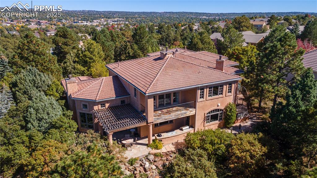 4896 Stonehill Road Colorado Springs, CO 80918 - Photo 34 of 42 an aerial view of a house with a yard