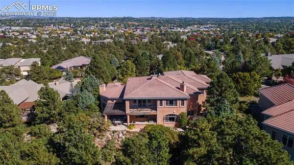 an aerial view of a house with a yard sitting space