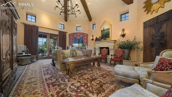 a living room with furniture fireplace and flat screen tv
