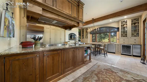 a kitchen with stainless steel appliances granite countertop a sink and cabinets