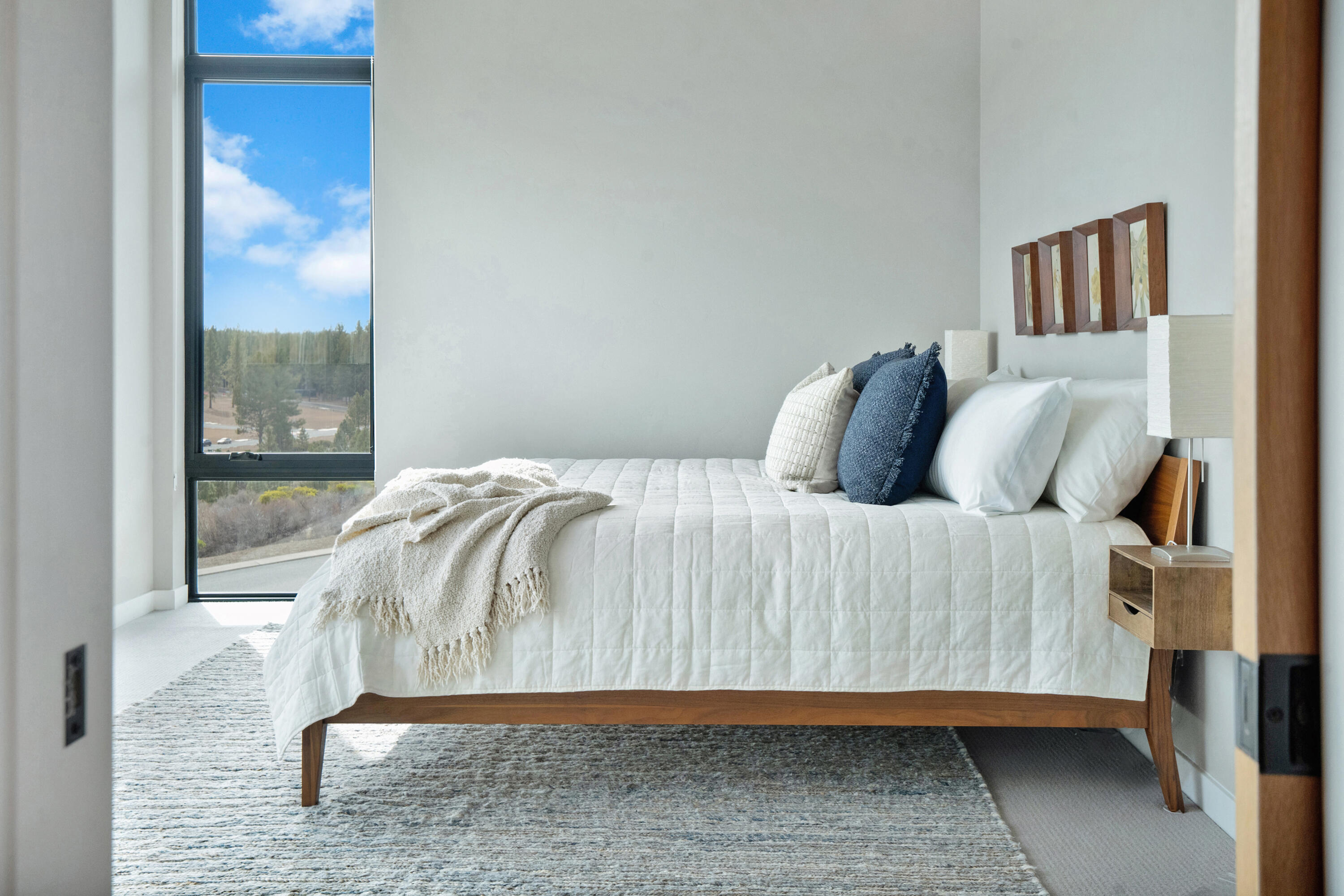 61250 Meeks Trail Bend, OR 97702 - Photo 24 of 43 a bedroom with a bed and glass window