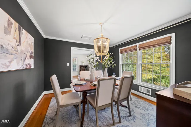 a living room with furniture a rug and a flat screen tv