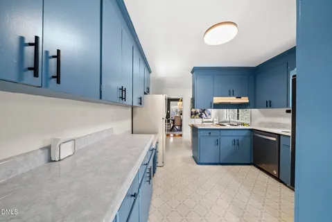 a white refrigerator freezer sitting in a kitchen