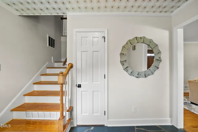 an entryway view with staircase