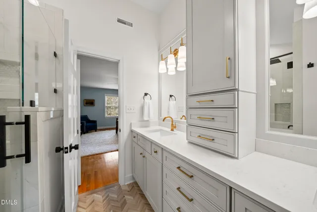 a bathroom with a bathtub and a shower