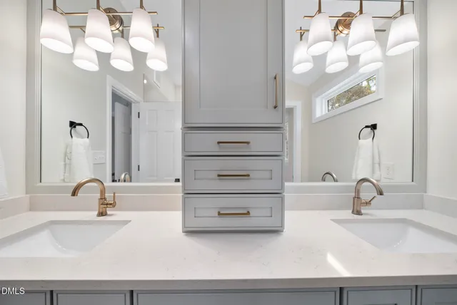 a spacious bathroom with a shower and a sink