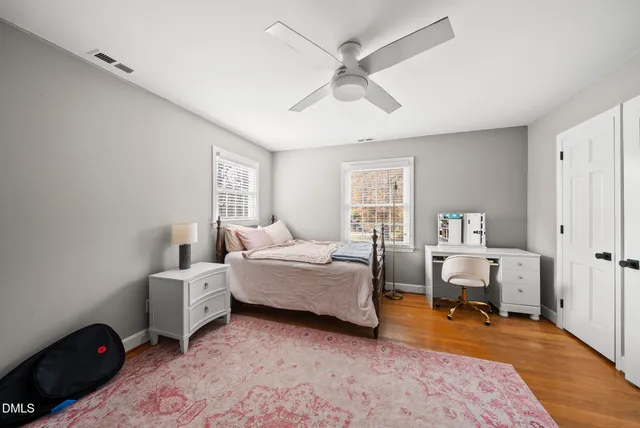 a bathroom with a granite countertop sink mirror and a shower
