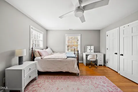a bedroom with bed and window