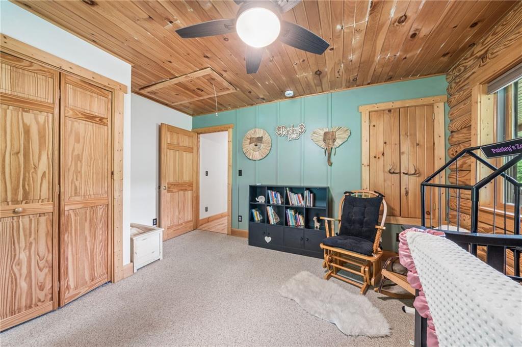 905 Indian Creek Valley Road Normalville, PA 15469 - Photo 21 of 38 a view of a livingroom with furniture and a window