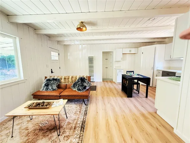 a room with furniture and wooden floor