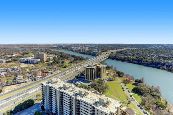 a view of a swimming pool and lounge chairs