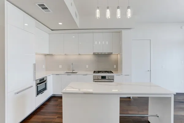 a kitchen with a stove and a refrigerator