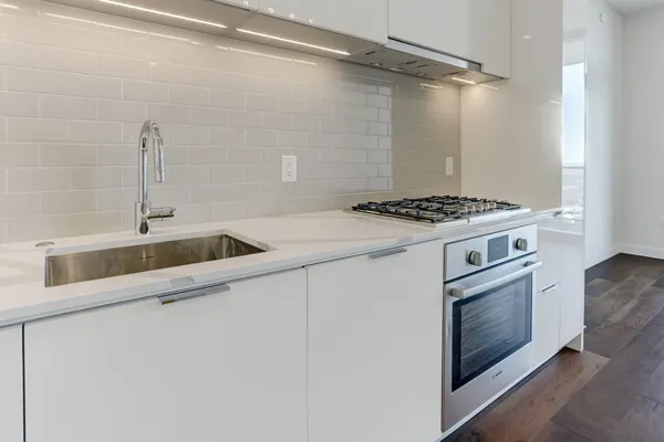 a kitchen with a stove and a sink