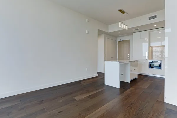 a view of kitchen with wooden floor