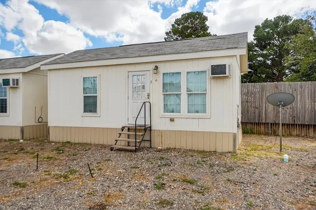 a house with trees in the background