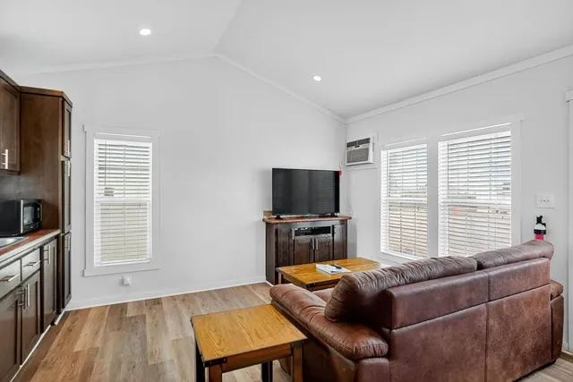 a bedroom with a bed and a view of closet