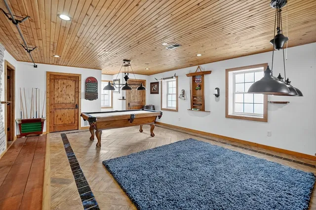 a balcony with furniture and wooden floor