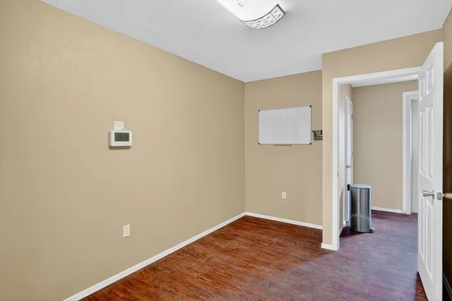 a view of livingroom with hardwood floor and hallway