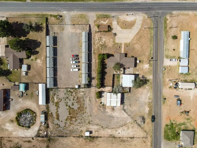 an aerial view of residential houses with outdoor space