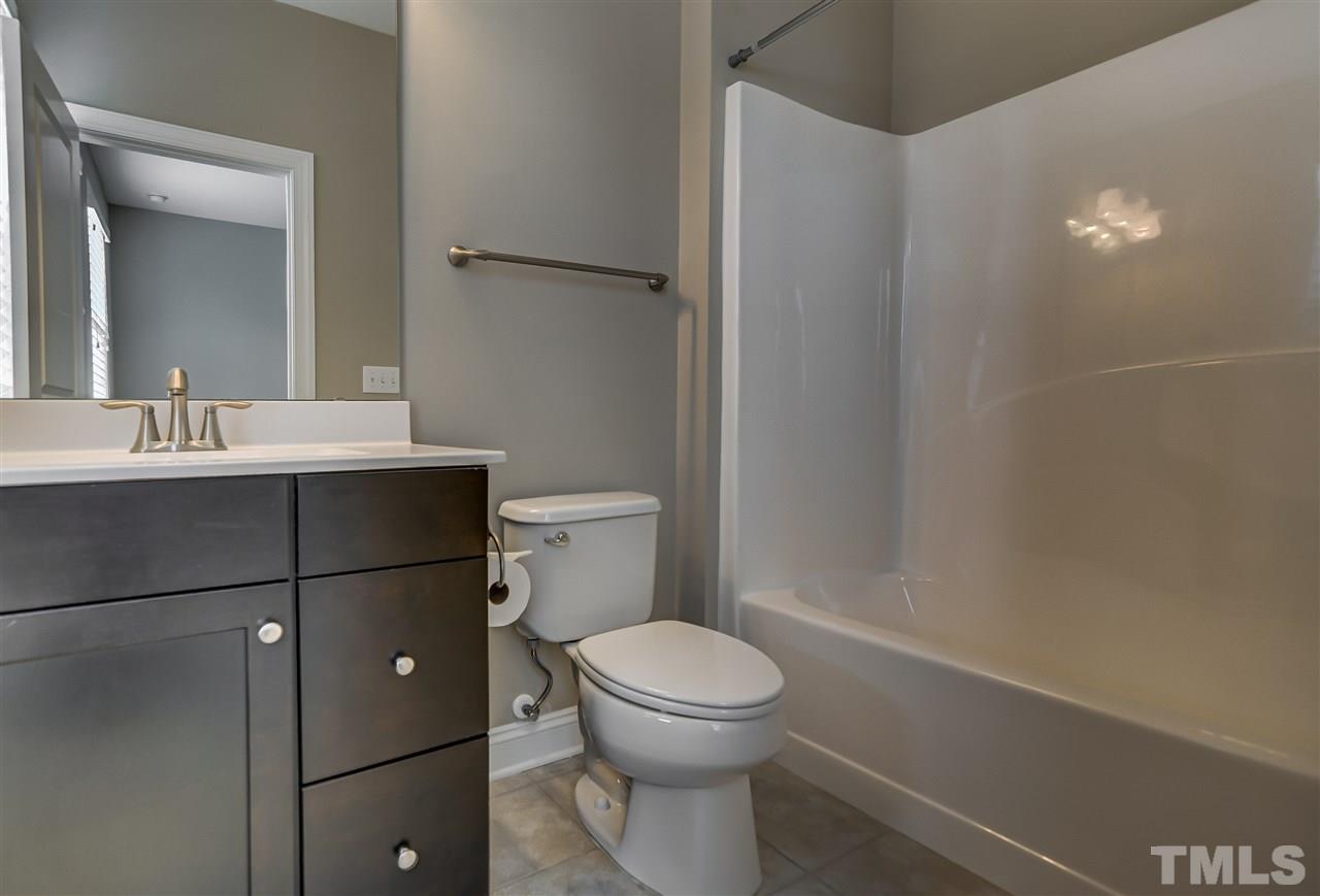3606 Winifred Way Raleigh, NC 27609 - Photo 12 of 18 a bathroom with a sink a toilet and shower