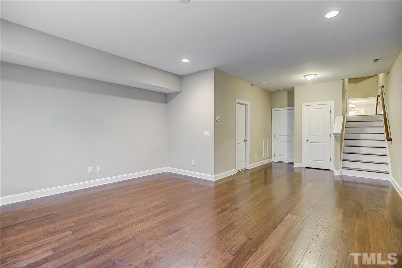 3606 Winifred Way Raleigh, NC 27609 - Photo 15 of 18 a view of an empty room with wooden floor