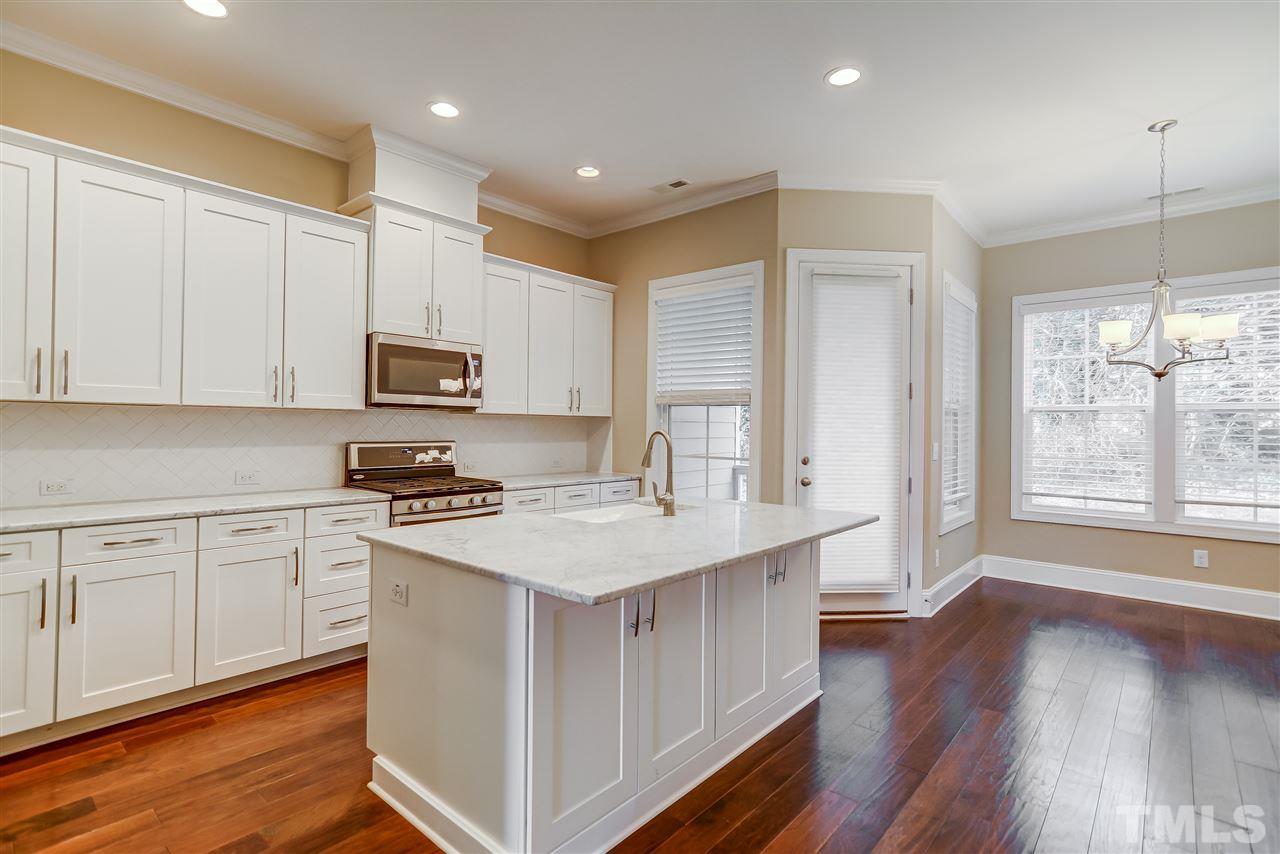 3606 Winifred Way Raleigh, NC 27609 - Photo 5 of 18 a kitchen with appliances a sink and cabinets