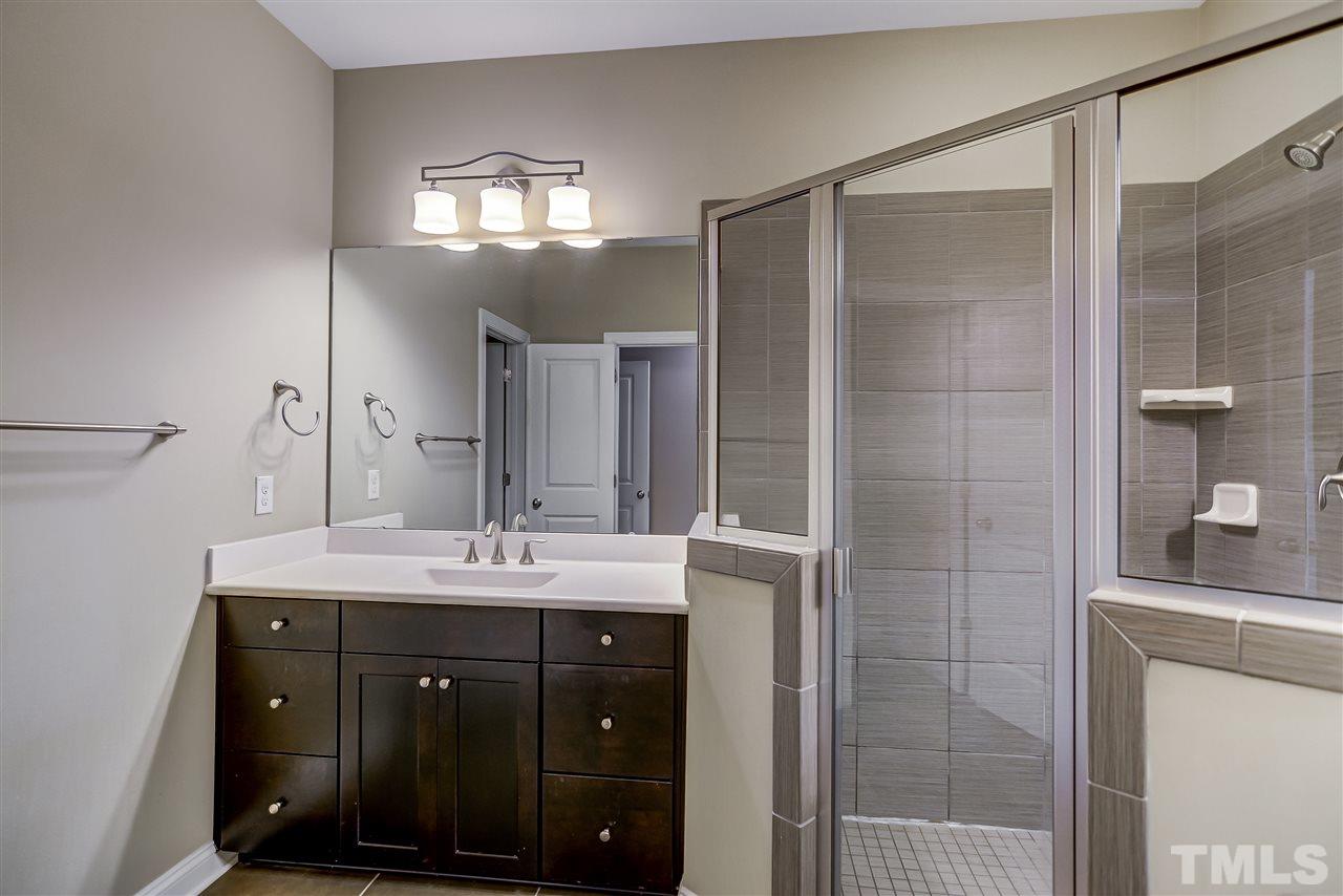 3606 Winifred Way Raleigh, NC 27609 - Photo 10 of 18 a bathroom with a sink and a mirror