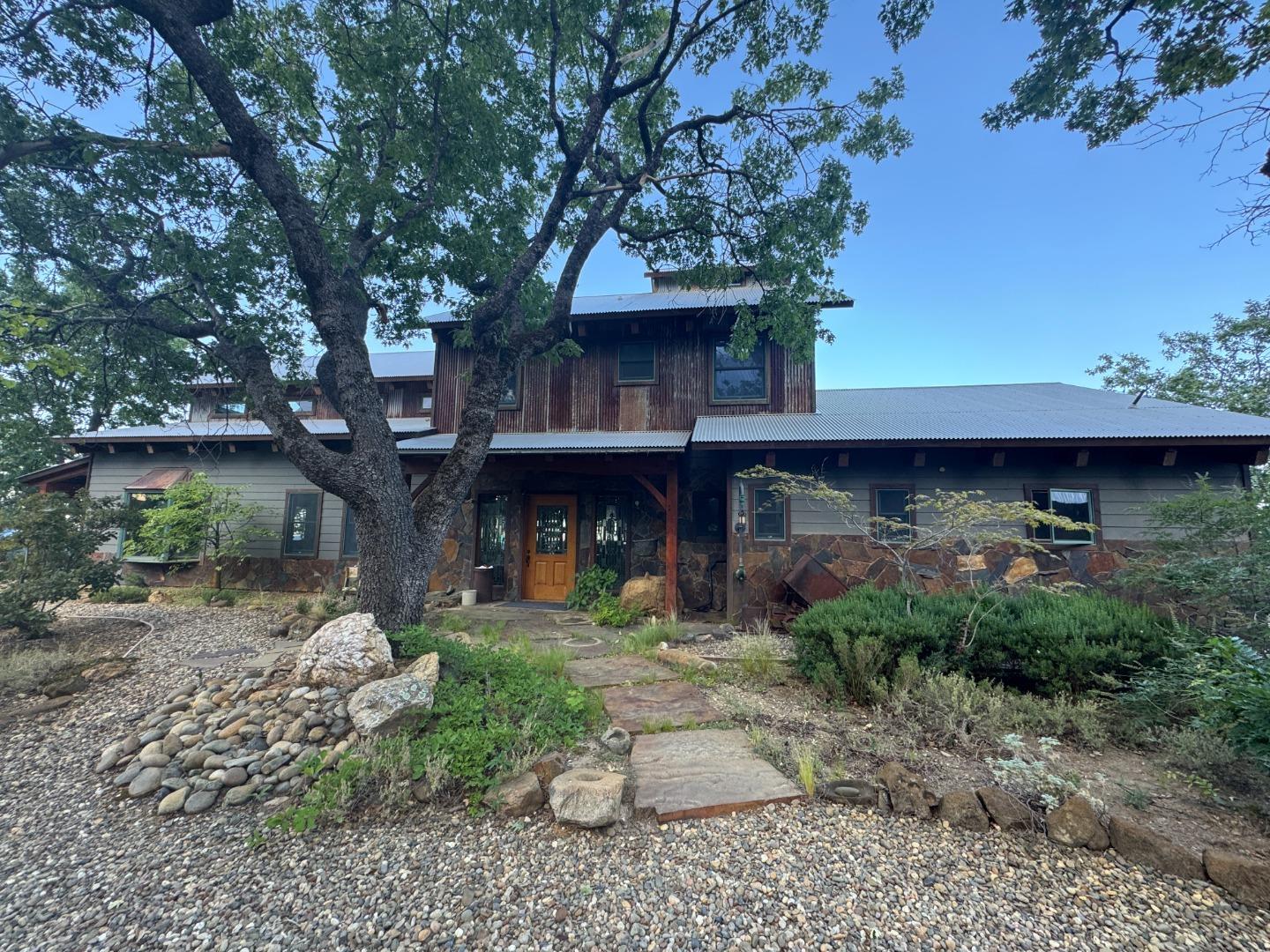 2251 Folendorf Road Murphys, CA 95247 - Photo 1 of 39 a front view of a house with garden