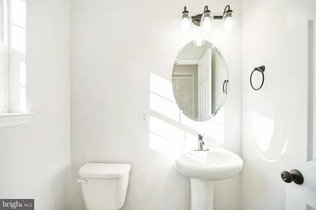 a bathroom with a sink and mirror